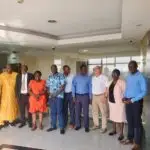 Razaki Omia (left), the CEO Omia Agribusiness during the SIYEP Project Steering Committee Meeting in Kampala.